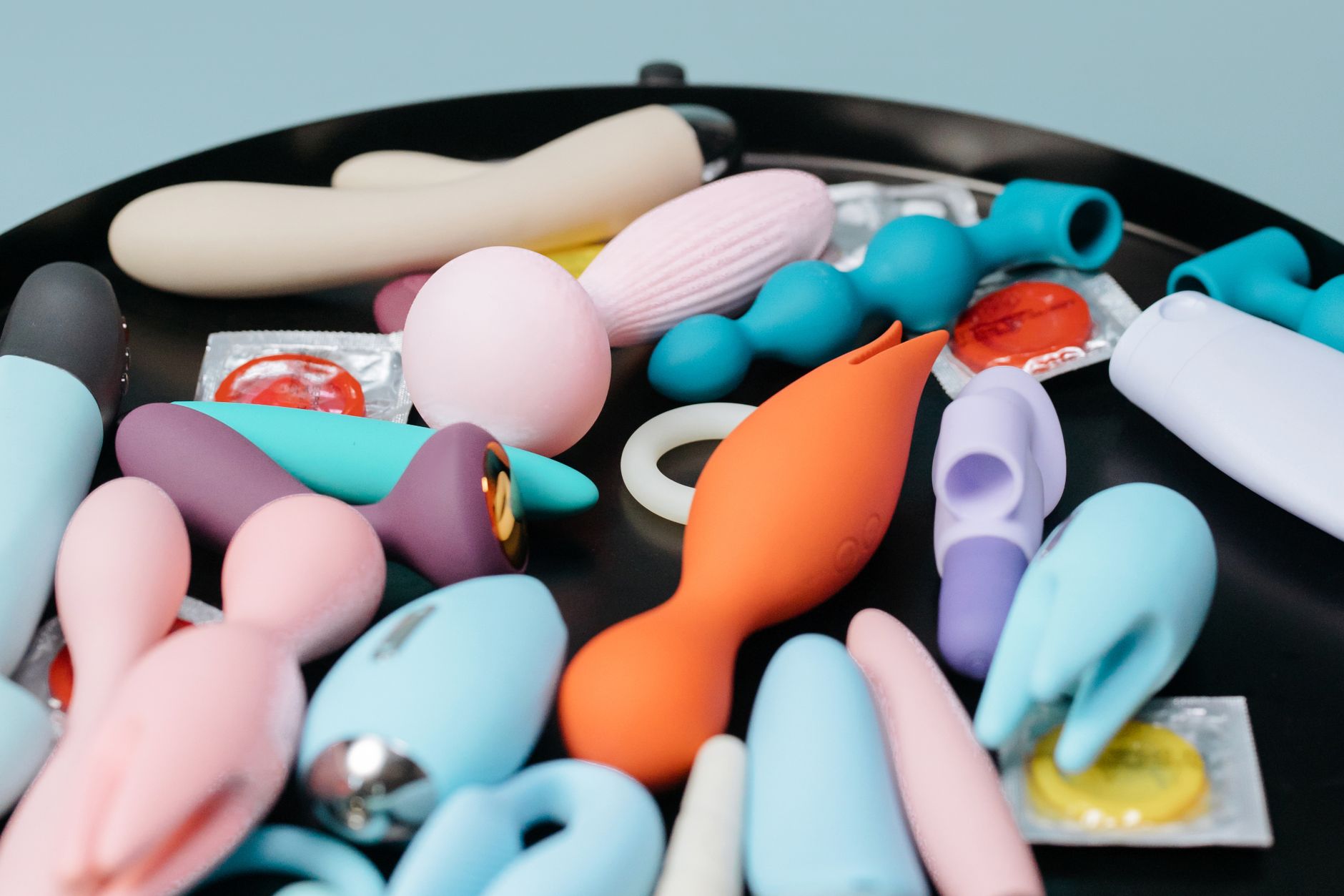 A vibrant collection of various personal massagers and toys displayed together